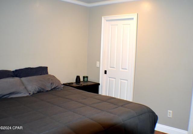 bedroom with ornamental molding