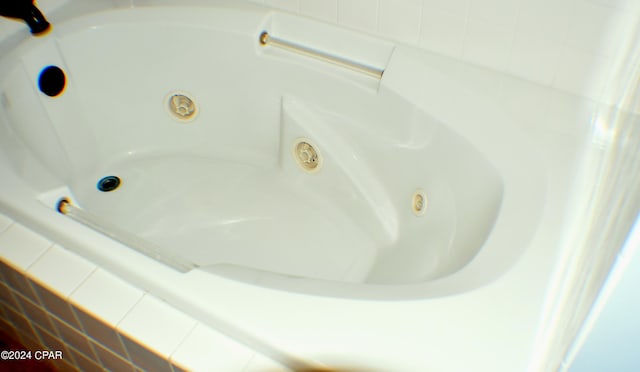 interior details with a relaxing tiled tub