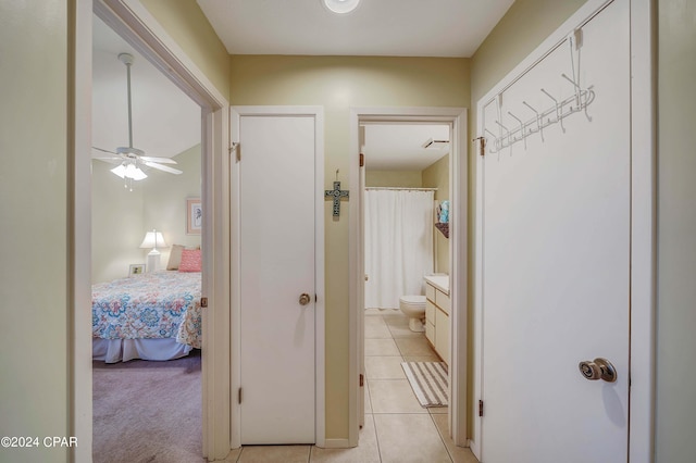 hallway featuring light tile patterned floors