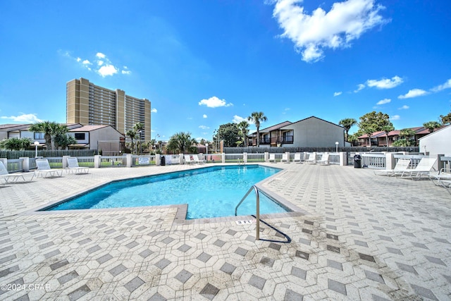 view of swimming pool with a patio area