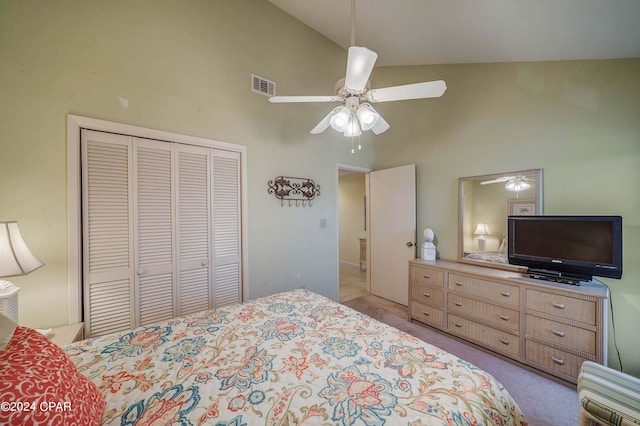 carpeted bedroom with high vaulted ceiling, a closet, and ceiling fan