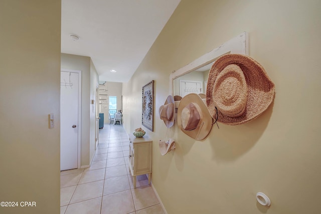 corridor featuring light tile patterned floors