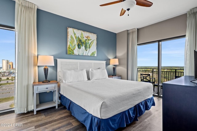 bedroom with access to exterior, dark wood-type flooring, and ceiling fan