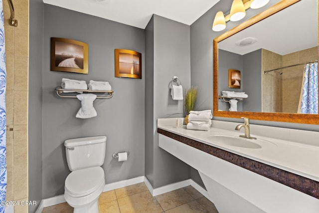 bathroom featuring sink, curtained shower, toilet, and tile patterned flooring