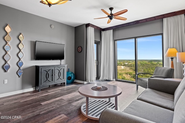 living room featuring wood-type flooring and ceiling fan