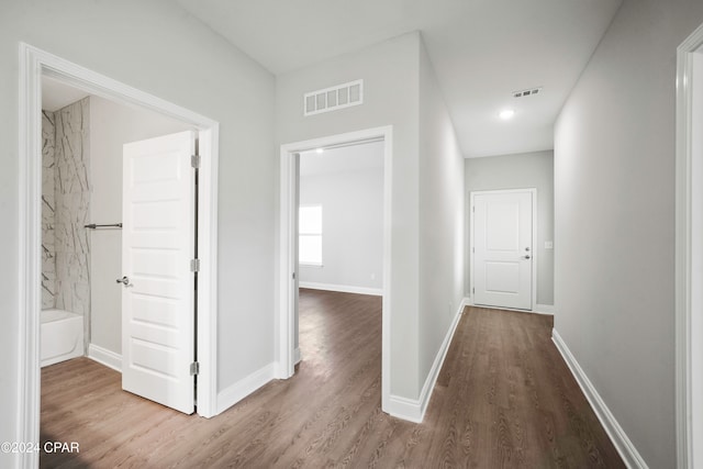 hallway featuring hardwood / wood-style flooring