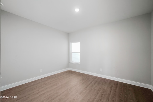 empty room featuring hardwood / wood-style flooring