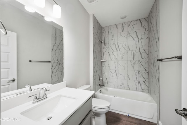 full bathroom with toilet, tiled shower / bath combo, vanity, and hardwood / wood-style flooring