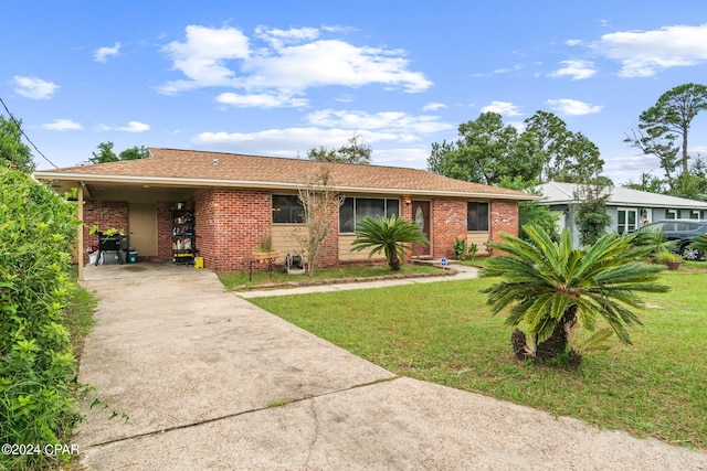 single story home featuring a front yard and a carport