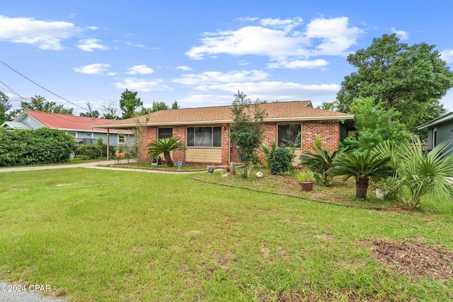 ranch-style home with a front yard