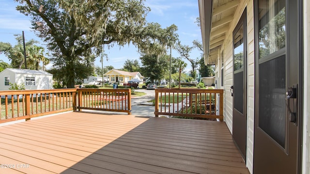 wooden deck with a storage unit