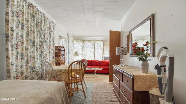 carpeted bedroom featuring ornamental molding