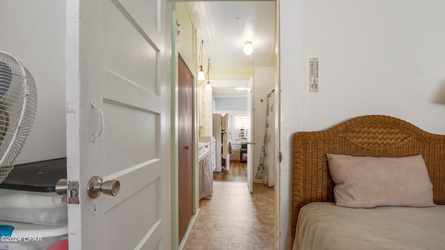 corridor with light hardwood / wood-style flooring