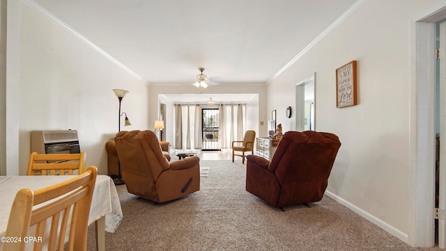 living room featuring ceiling fan, ornamental molding, heating unit, and carpet flooring