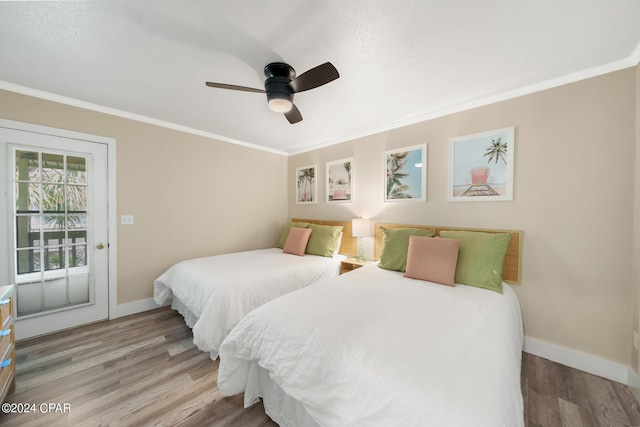 bedroom with access to outside, hardwood / wood-style floors, crown molding, and ceiling fan