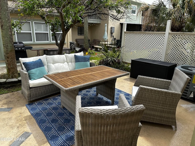 view of patio / terrace featuring an outdoor hangout area, central air condition unit, and area for grilling