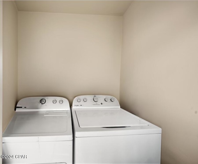 laundry room featuring washing machine and dryer