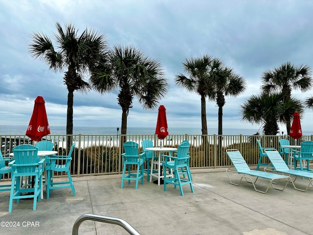 view of patio featuring a water view