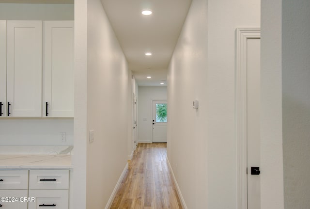 hall with light hardwood / wood-style flooring