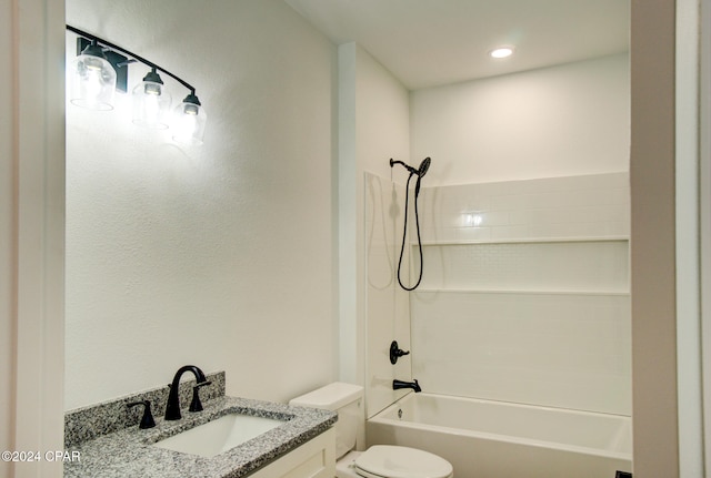 full bathroom with vanity, toilet, and shower / washtub combination