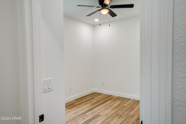 spare room with light hardwood / wood-style flooring and ceiling fan