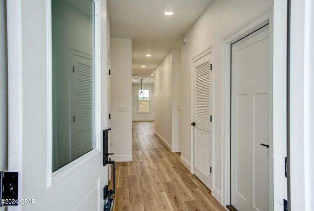 corridor featuring light wood-type flooring