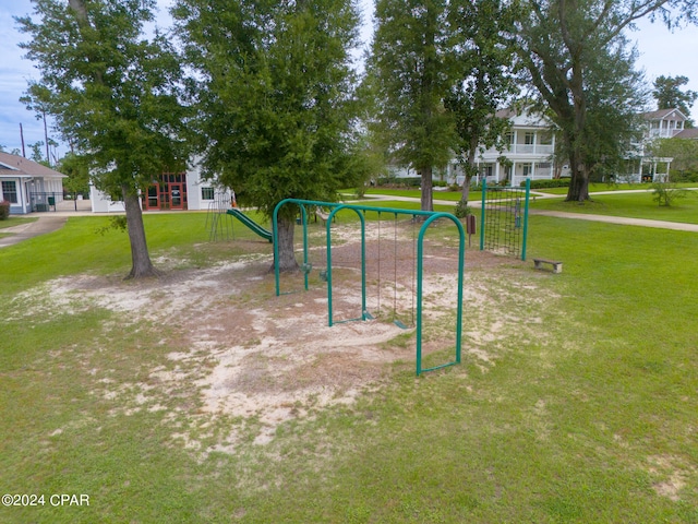 view of playground with a lawn