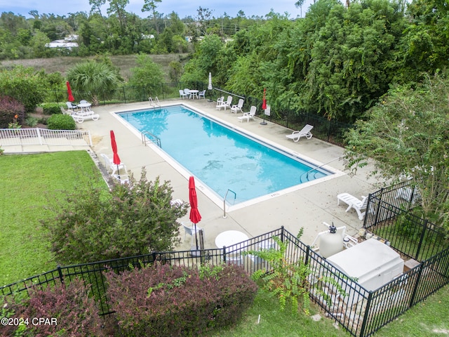 view of pool featuring a patio area