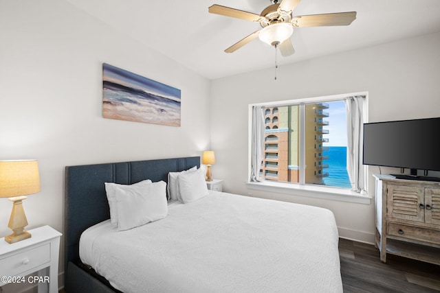 bedroom featuring ceiling fan and dark hardwood / wood-style flooring