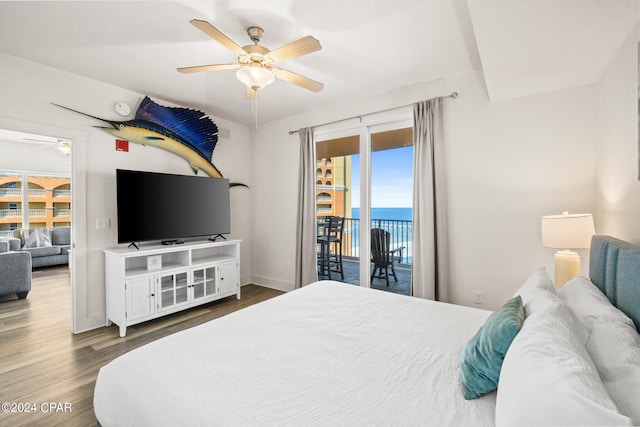 bedroom with hardwood / wood-style flooring, access to exterior, and ceiling fan