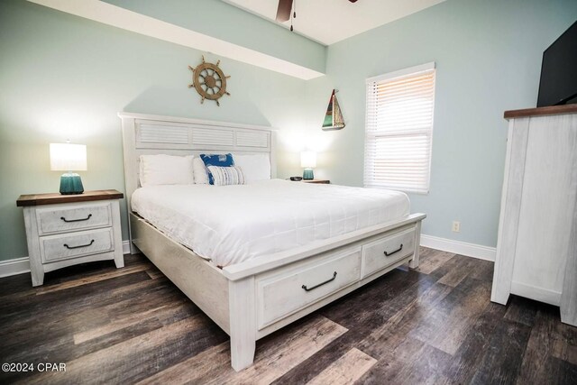 bedroom with dark hardwood / wood-style flooring and ceiling fan