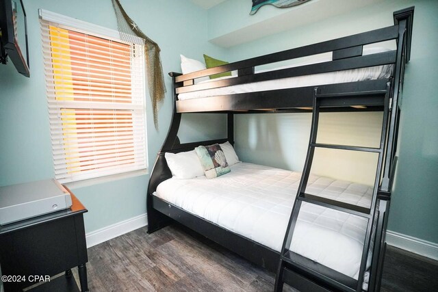 bedroom featuring dark wood-type flooring