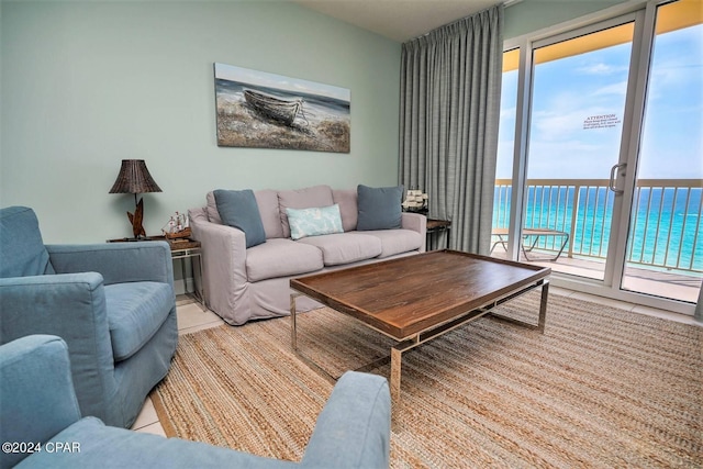 tiled living room with a water view