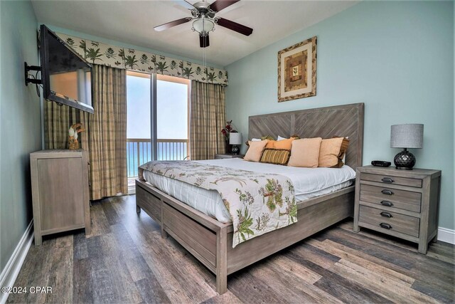 bedroom featuring ceiling fan, dark hardwood / wood-style floors, and access to exterior