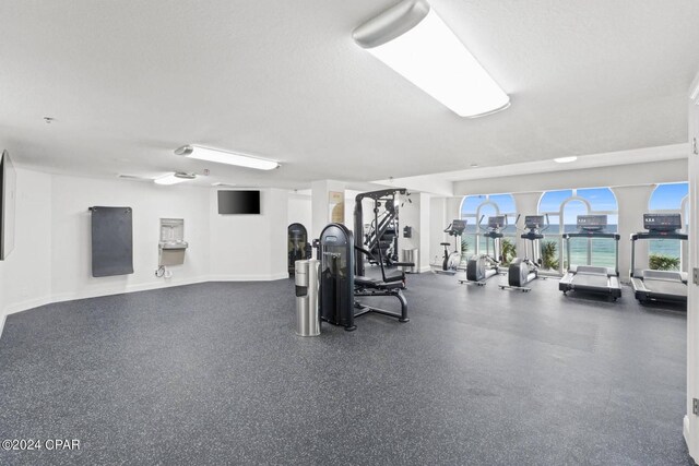 workout area with a textured ceiling