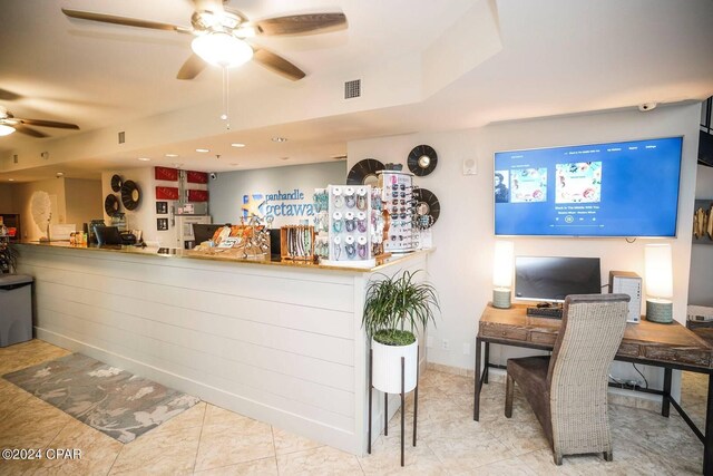 reception area with ceiling fan