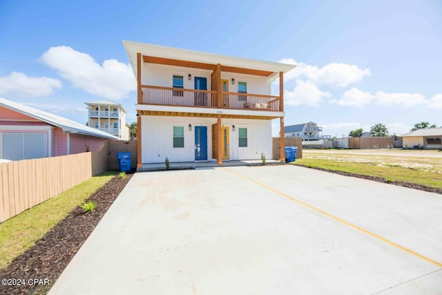 rear view of property with a balcony