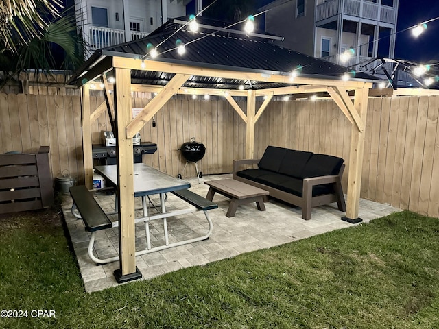 patio at twilight with a lawn and an outdoor living space