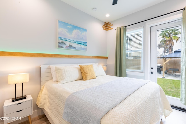 bedroom with light hardwood / wood-style floors and ceiling fan