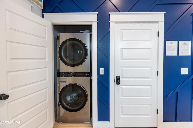 laundry area featuring stacked washer and dryer