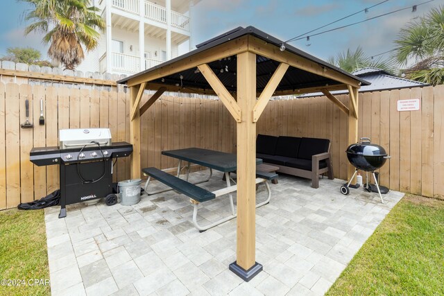 view of patio with a gazebo, area for grilling, and outdoor lounge area