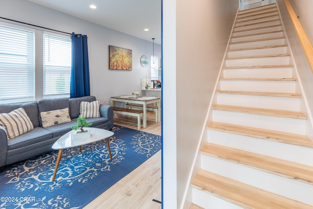 stairs with hardwood / wood-style flooring