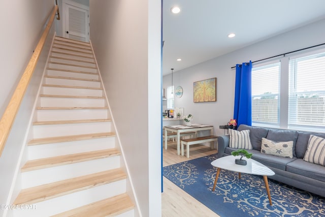 stairway featuring hardwood / wood-style floors