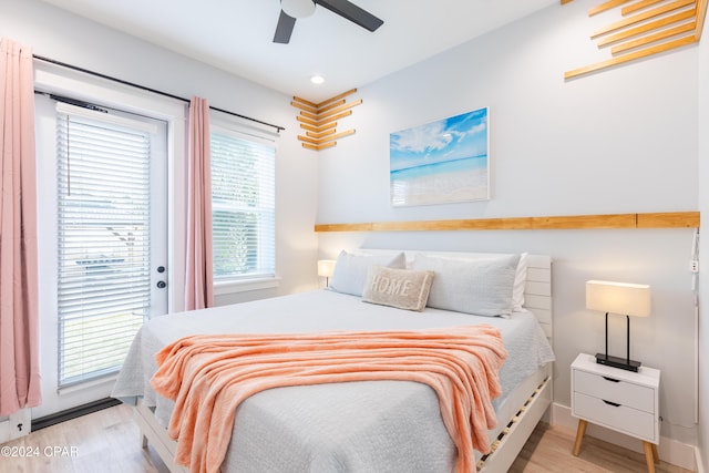 bedroom featuring access to outside, ceiling fan, and light hardwood / wood-style floors