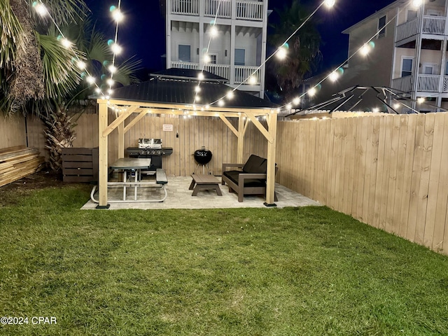 yard at twilight featuring a patio area