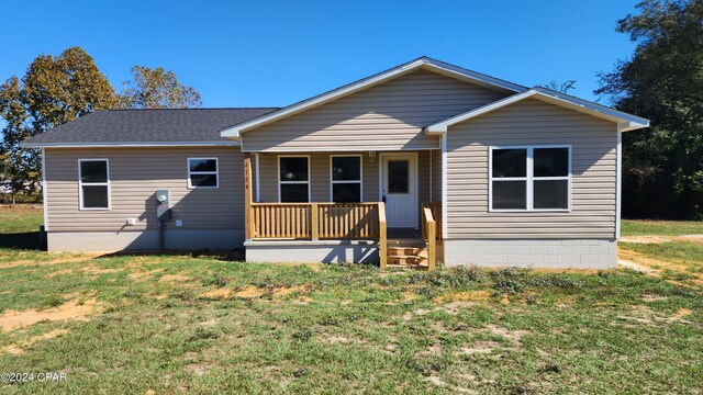 view of front of house featuring a front yard and covered porch