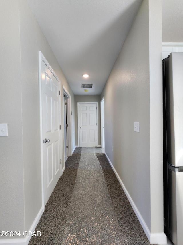 corridor with visible vents and baseboards