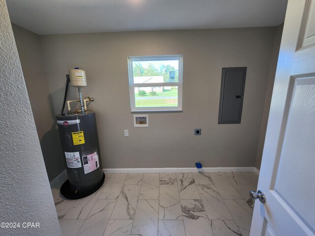 kitchen featuring appliances with stainless steel finishes, marble finish floor, white cabinetry, and baseboards