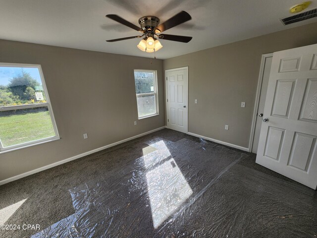 utility room with electric panel and electric water heater