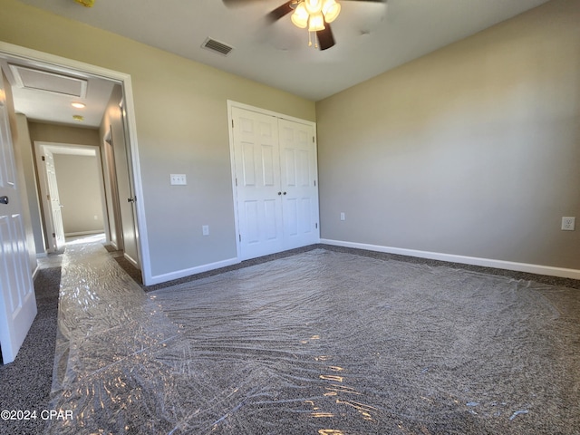 unfurnished bedroom featuring baseboards, a closet, visible vents, and a ceiling fan